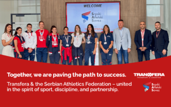 Serbian Athletics Federation athletes and Transfera representatives pose together at Transfera headquarters, highlighting their partnership focused on sport, teamwork, and shared values.