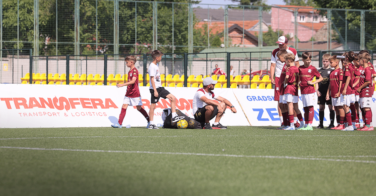Young football players competing at the Dragan Mance Cup youth tournament, supported by Transfera as an official sponsor and logistics partner.